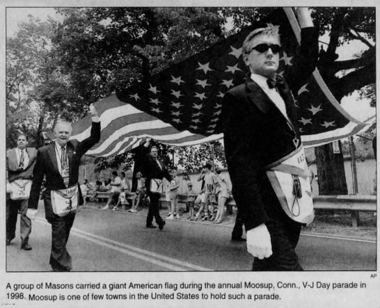 Group of Masons carry giant American Flag during V-J Day Parade